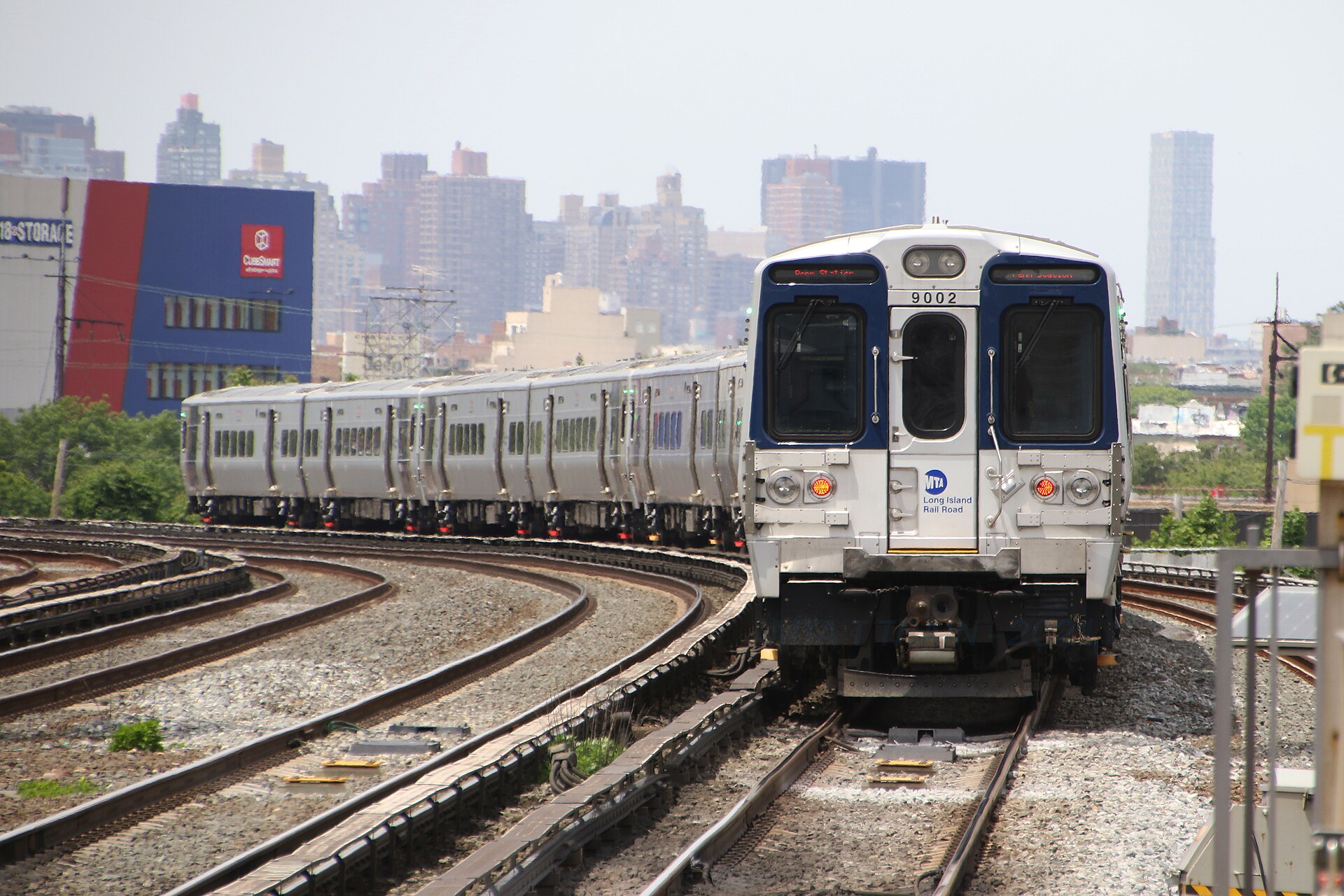 A Penn Station-bound LIRR train departs Woodside (Credit - wikimedia commons, Mtattrain)