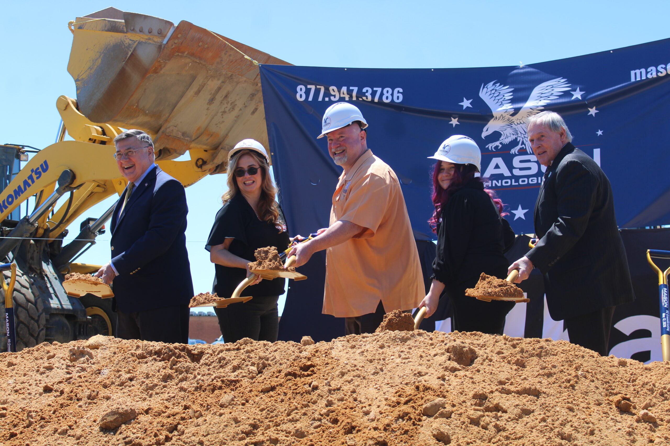 (L-R) Exec. Romaine, Jennifer and Adam Mason and family, and Supervisor Wehrheim break ground on the new facility in Hauppauge (Credit - Matt Meduri)